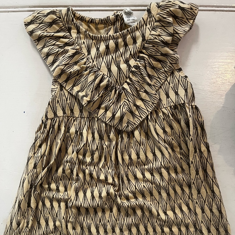 Kate Quinn sleeveless tan dress